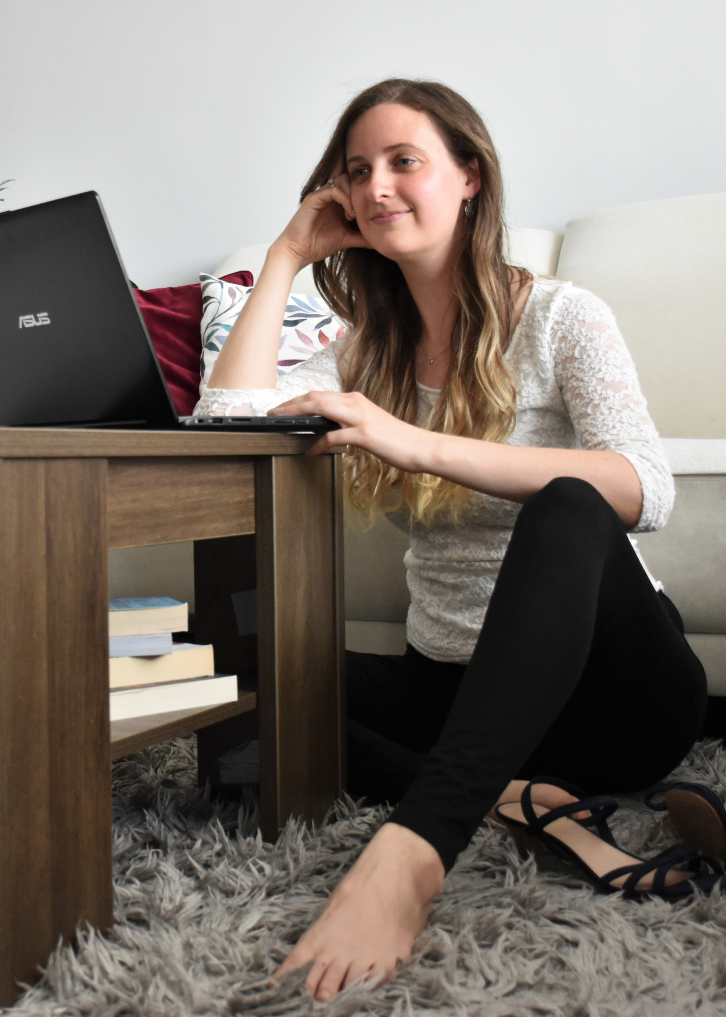 Katalyna work on her notebook in living room